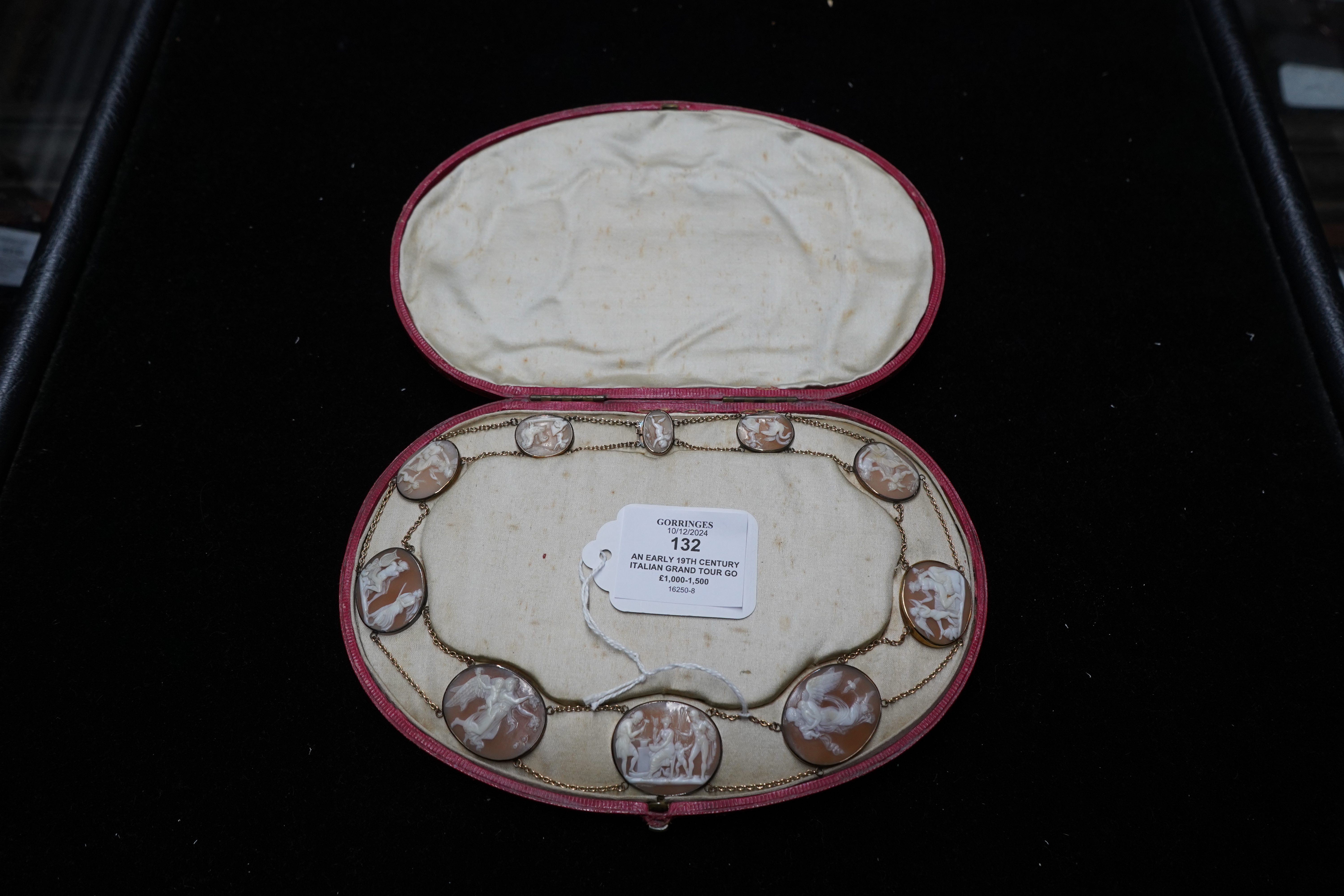 An early 19th century Italian Grand Tour gold double chain link and ten graduated oval cameo shell set necklace